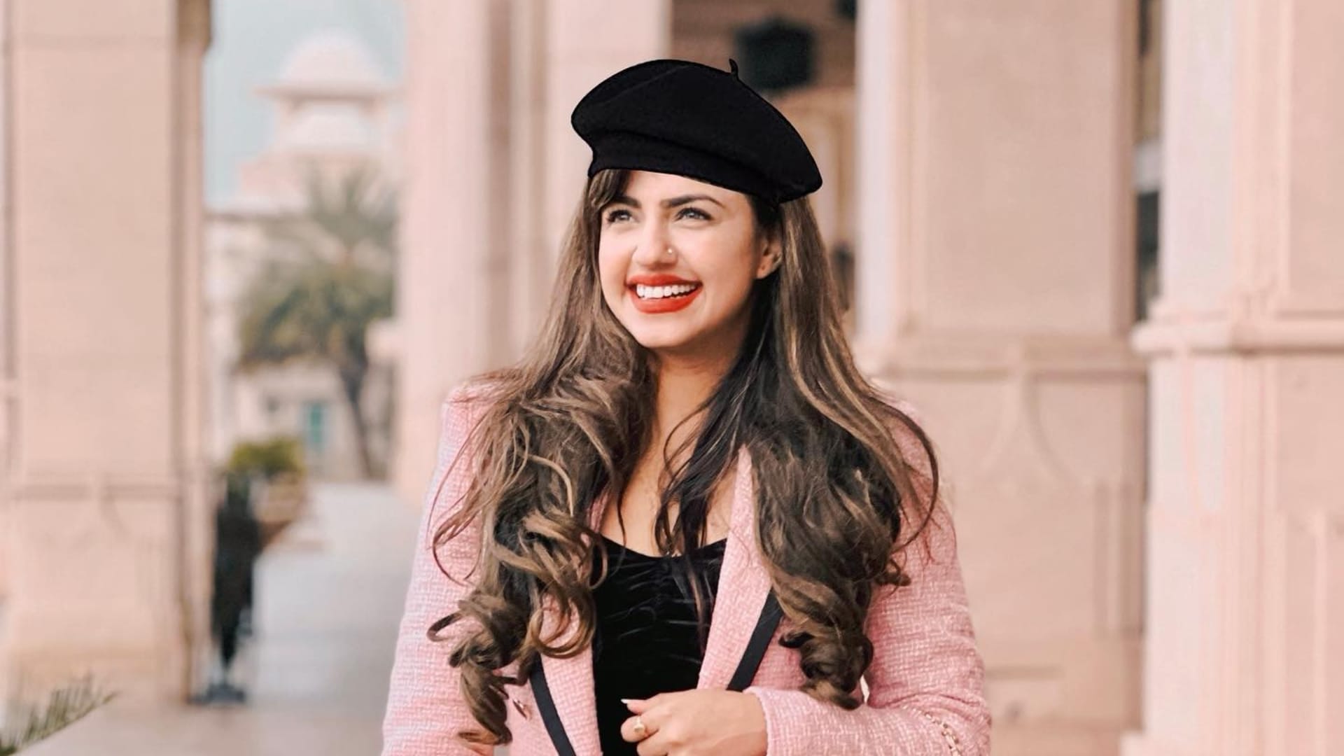 A person wearing a stylish winter cap, symbolizing the blend of fashion and cultural exploration in family travel.