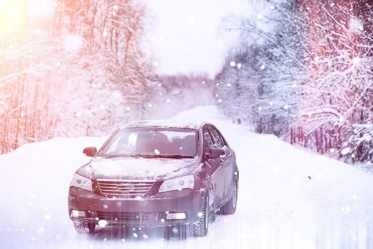 Benefits of driving battery-powered vehicles electric car on icy roads and in snowy conditions