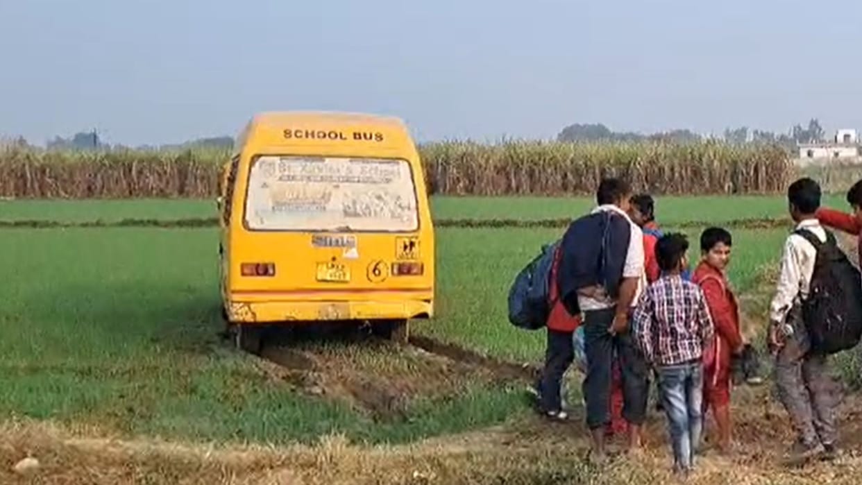 A school bus full of children landed in a field due to steering failure