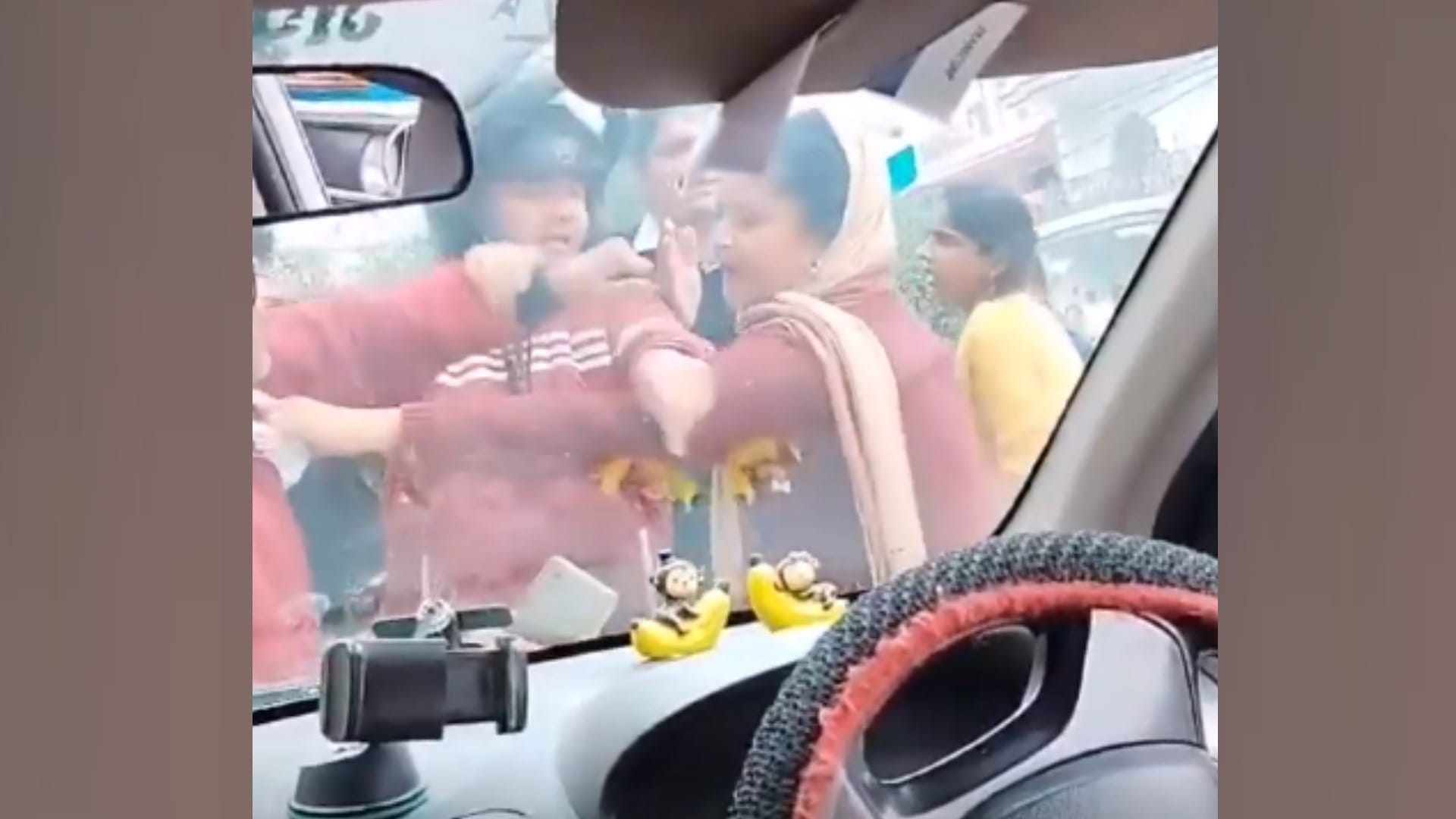 A woman beats cab driver after her scooty hits a cab.