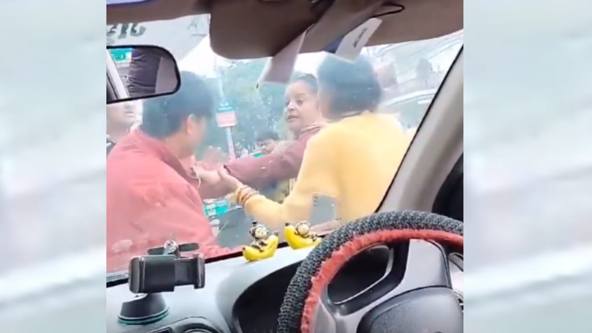A woman beats cab driver after her scooty hits a cab.