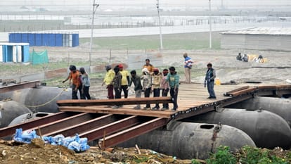 Old GT Pontoon Bridge and barrels of five culverts caved in, traffic halted