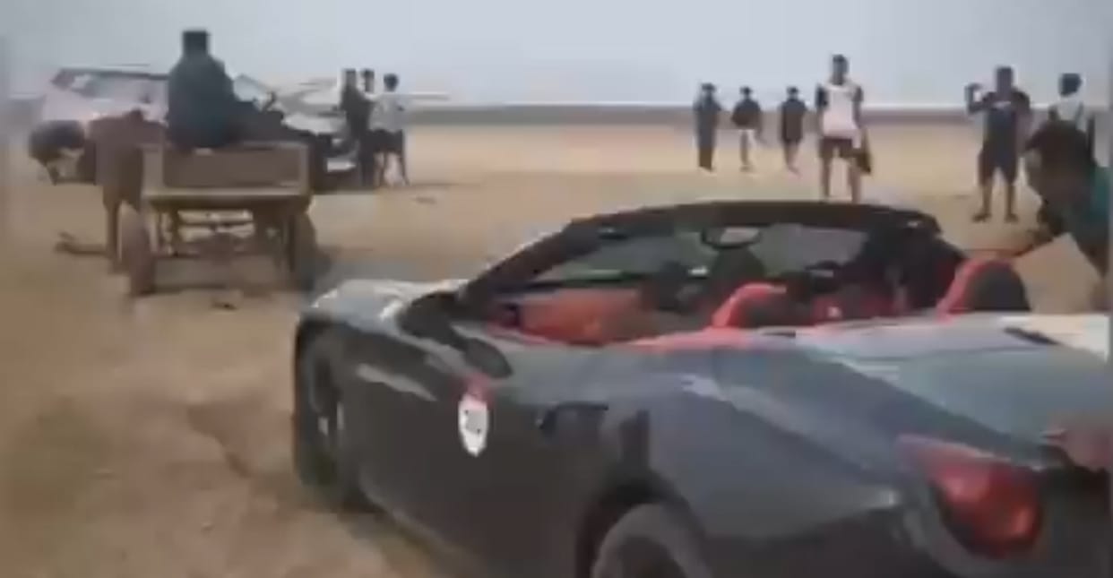 Ferrari luxury car stuck on sand at beach in Alibaug Maharashtra pulled by bullock cart viral video