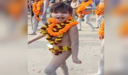 Nine-year-old Naga sanyasi Gopal Giri engaged in devotion to Mahadev with ashes on his body