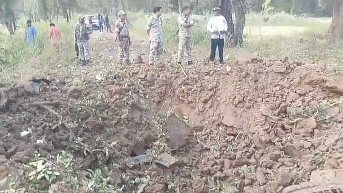 Naxal Attack Vehicle parts found hanging from a tree 15 feet above a seven feet deep crater on ground in Bijap