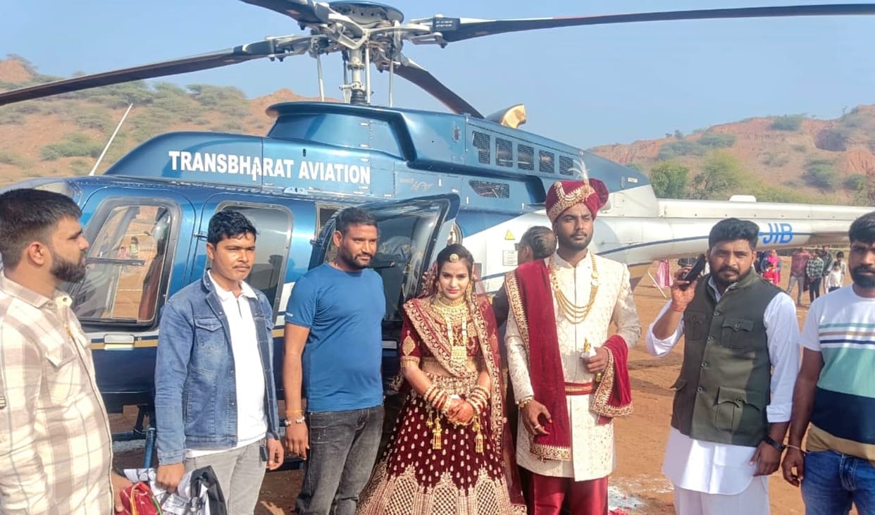 The groom arrived by helicopter to send off the farmer's daughter