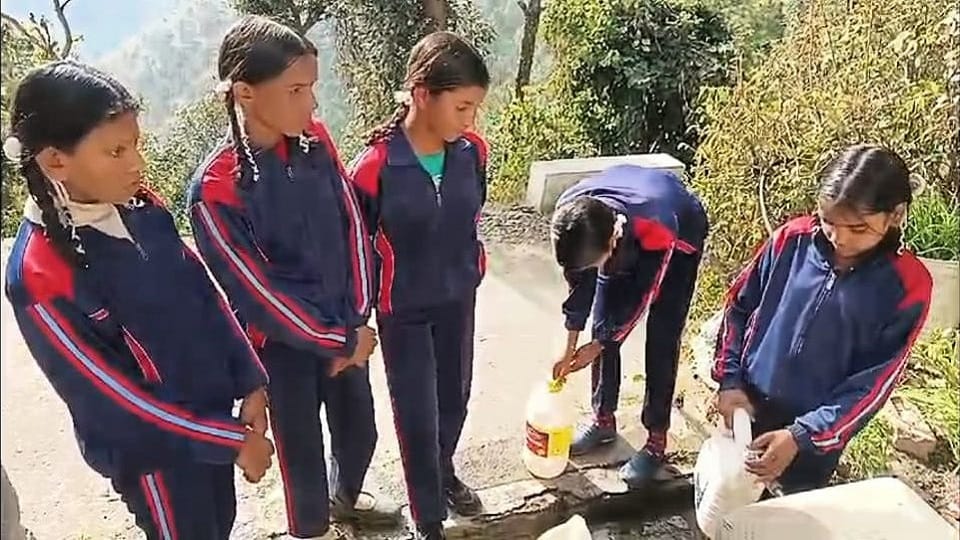 Children abandoning studies in cold and carrying water for mid-day meal in champawat