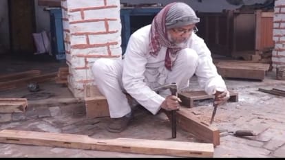 judge giving verdicts while sitting on a chair made by the prisoners of Bareilly Central Jail