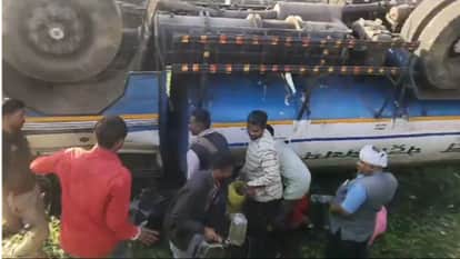 tanker overturned on road people gathered with buckets and gallons to fill diesel in sonbhadra