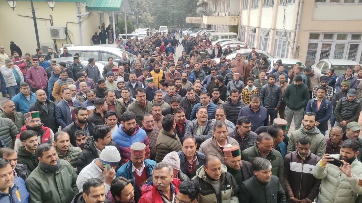Himachal Engineers and employees protest outside the electricity board headquarters in Shimla