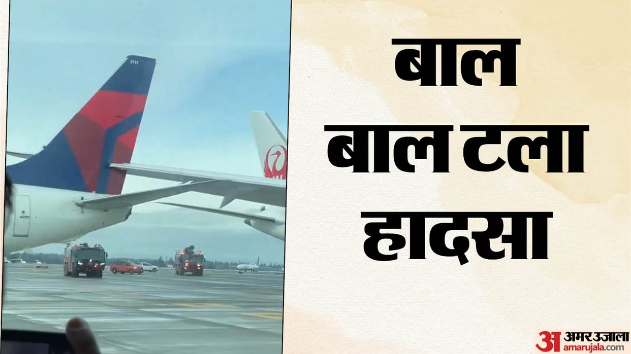 Parked Delta plane apparently clipped by Japan Airlines plane that was taxiing at Seattle airport