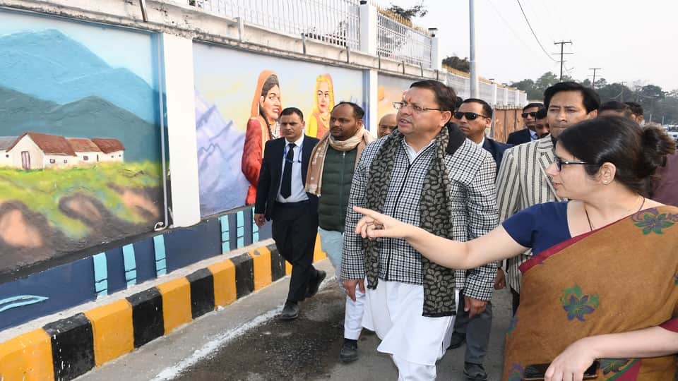CM Pushkar Singh Dhami painted on a wall in haldwani