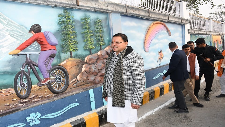 CM Pushkar Singh Dhami painted on a wall in haldwani