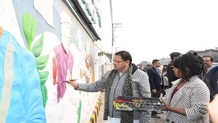 CM Pushkar Singh Dhami painted on a wall in haldwani