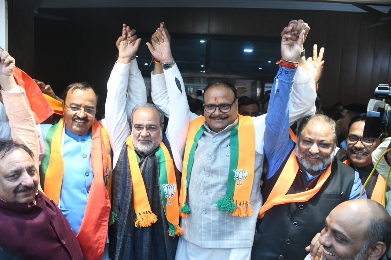 BJP activists celebrate victory in Delhi and Milkipur assembly seat.