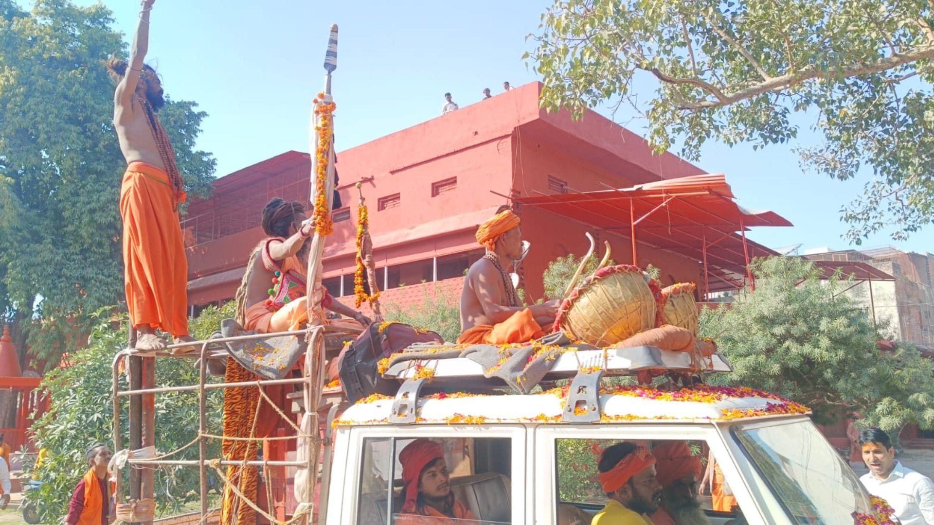 procession of sadhus and sanyasis in Photo flowers showered on way