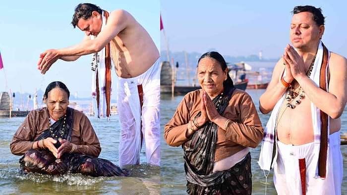 CM Dhami took a dip at Triveni Sangam in Prayagraj Maha Kumbh made his mother take a bath Watch Photos