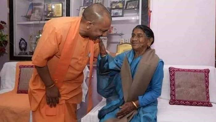 CM Yogi Adityanath Uttarakhand Visit sisters bid farewell to CM Yogi by feeding him curd and sugar