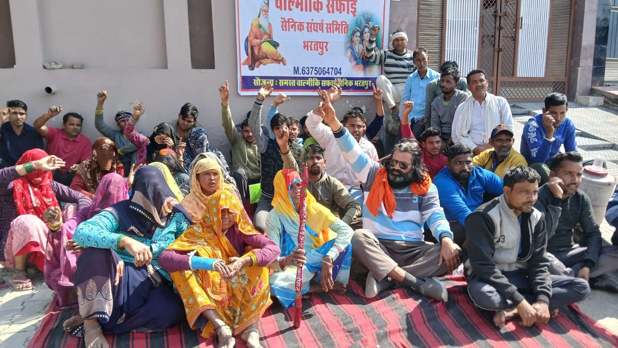 Temporary cleaning workers staged a sit-in protest in front of the BJP office