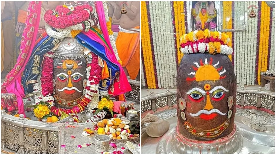 Baba Mahakal decorated like this in Bhasma Aarti today with Sun and Moon decorated on his head.