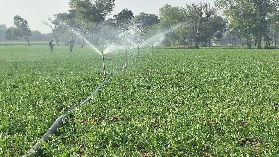 Farmers using modern technology for water in fields
