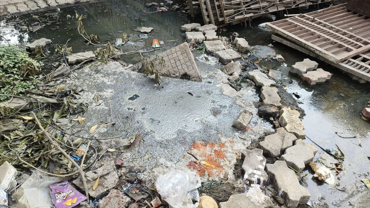 Sewer system with help of brick drain 50 meters ahead of Minister of State house