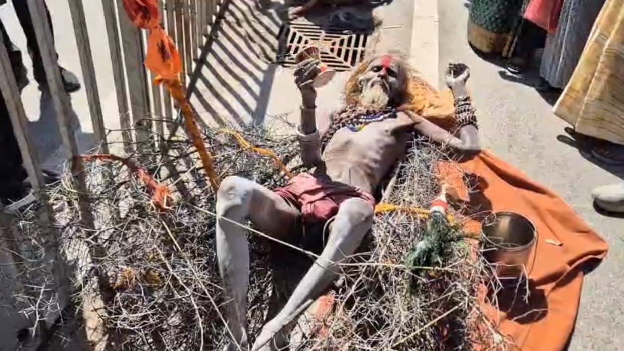 A monk lying on thorns has become a subject of curiosity for the people in Ayodhya.