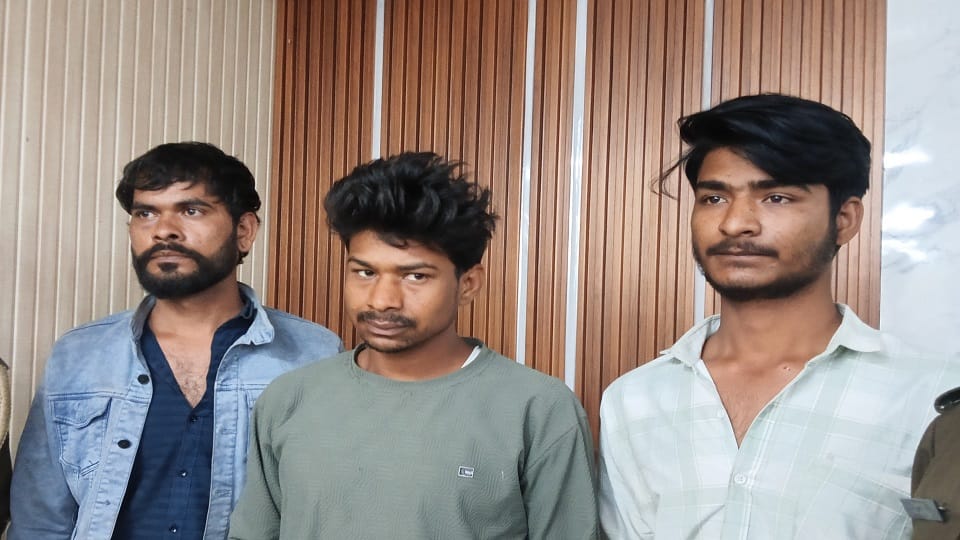 Three miscreants returning home after a court date robbed a young man's bike and his mobile