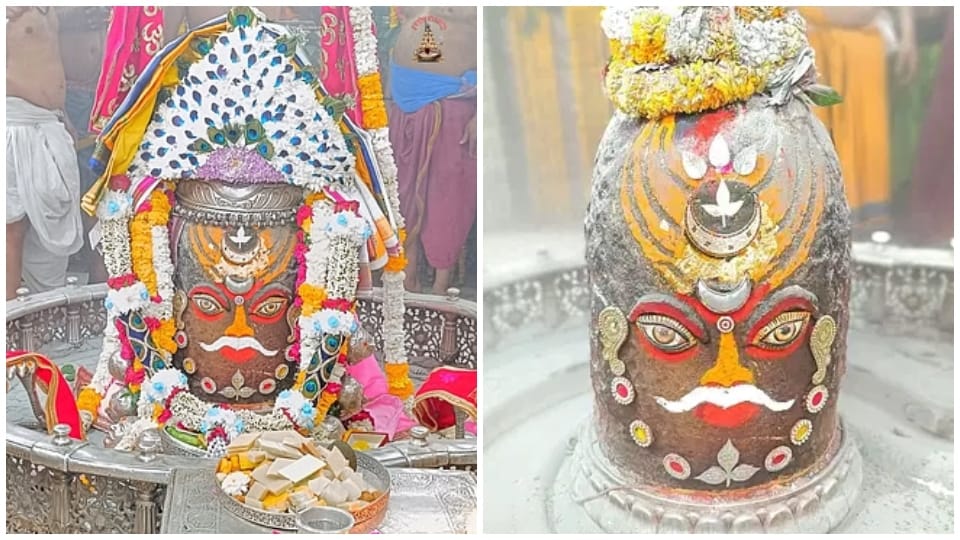 Baba Mahakal adorned with peacock feather garland and necklace in Bhasma Aarti
