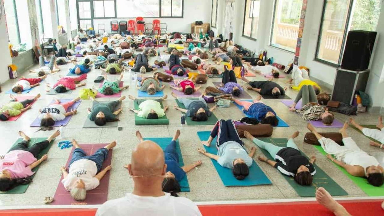 Rishikesh 37th International Yoga Festival in Parmarth, Sadhaks practicing various yoga postures