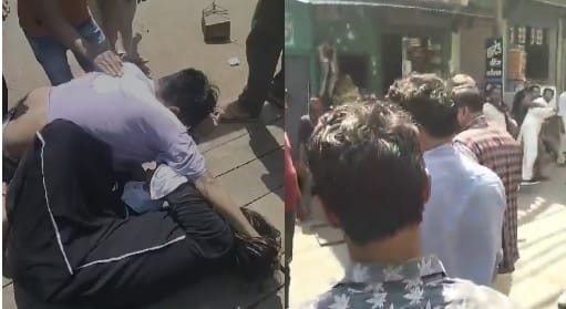 Young man and woman fight fiercely in public beat each other by grabbing each others hair dispute over land