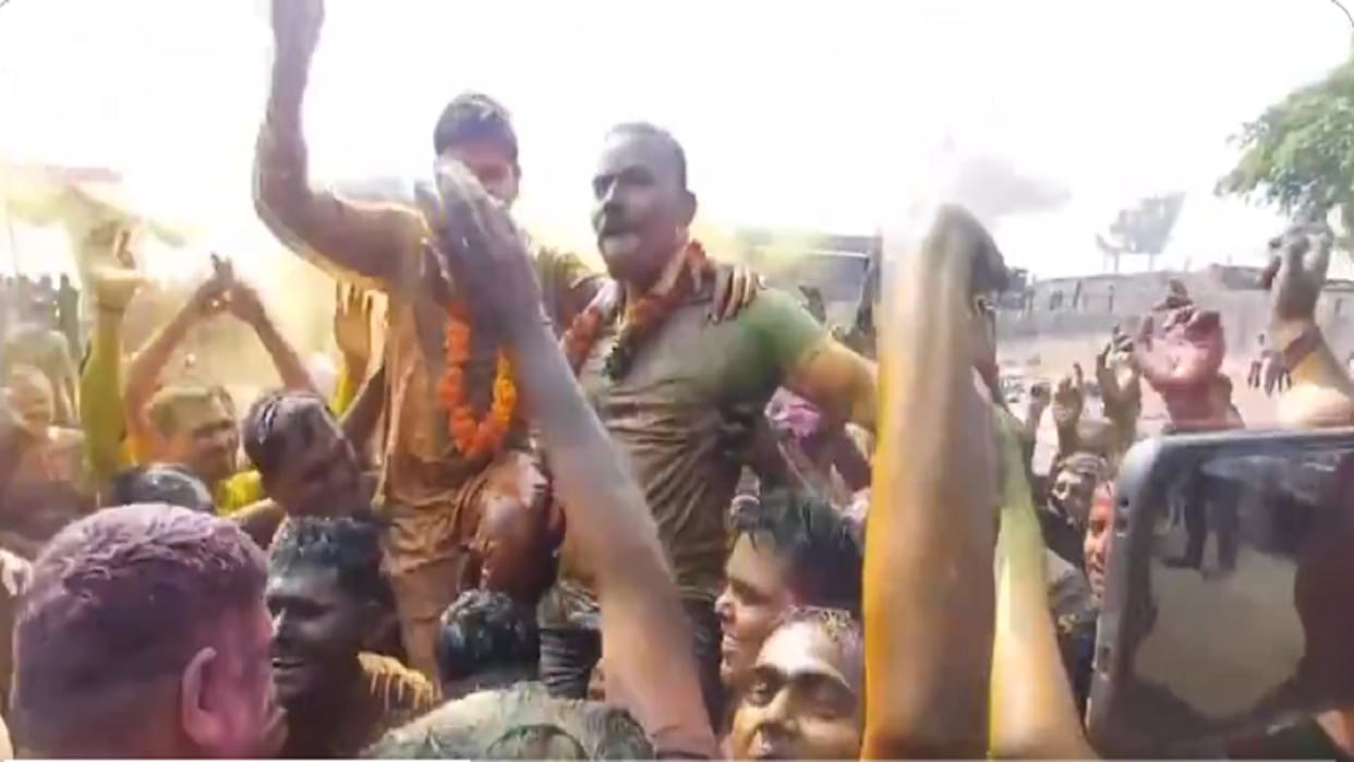 DM SP and CO along with other police personnel play with colours and dance as they celebrate Holi in sambhal
