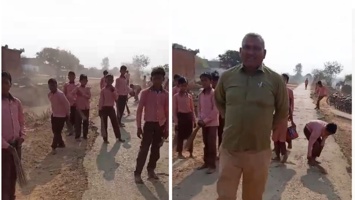 Students are sweeping the road in a government school