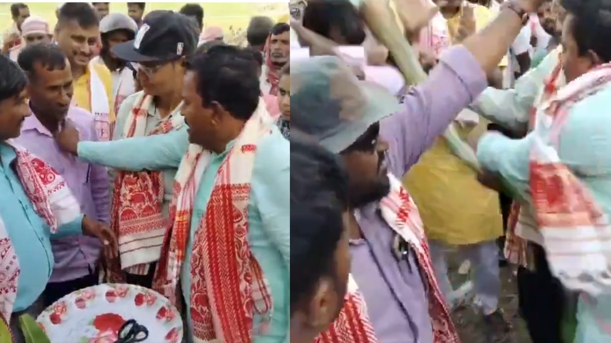 assam aiudf mla shamsul huda thrashes a man with banana plant for not putting red ribbon video viral