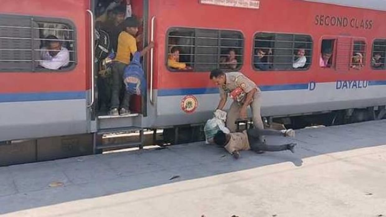 Two passengers jumped from a moving train the inspector saved them from falling down