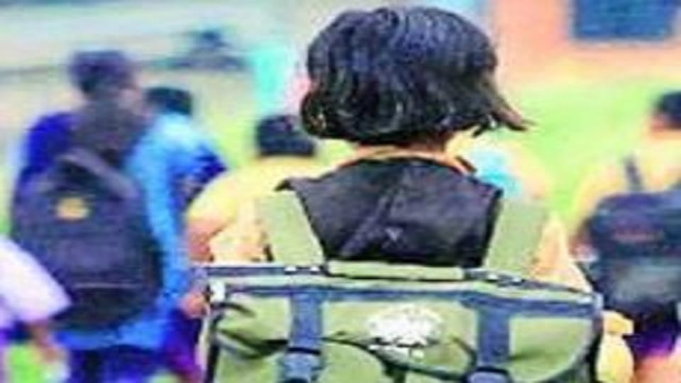 Children and teachers are reaching school by walking two kilometers on a rough road in champawat