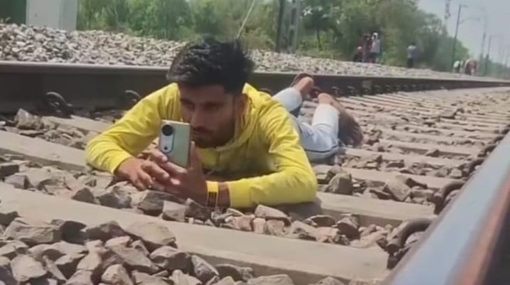 A young man made a reel by lying on the railway track a train passed over him GRP arrested him