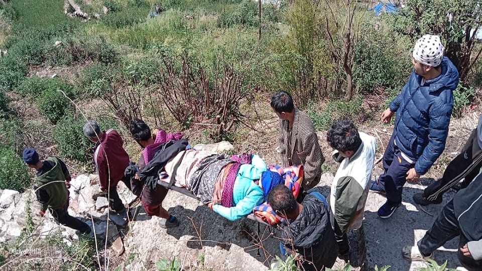 The injured woman was carried on a stretcher for eight kilometers to reach the road in munsiyari