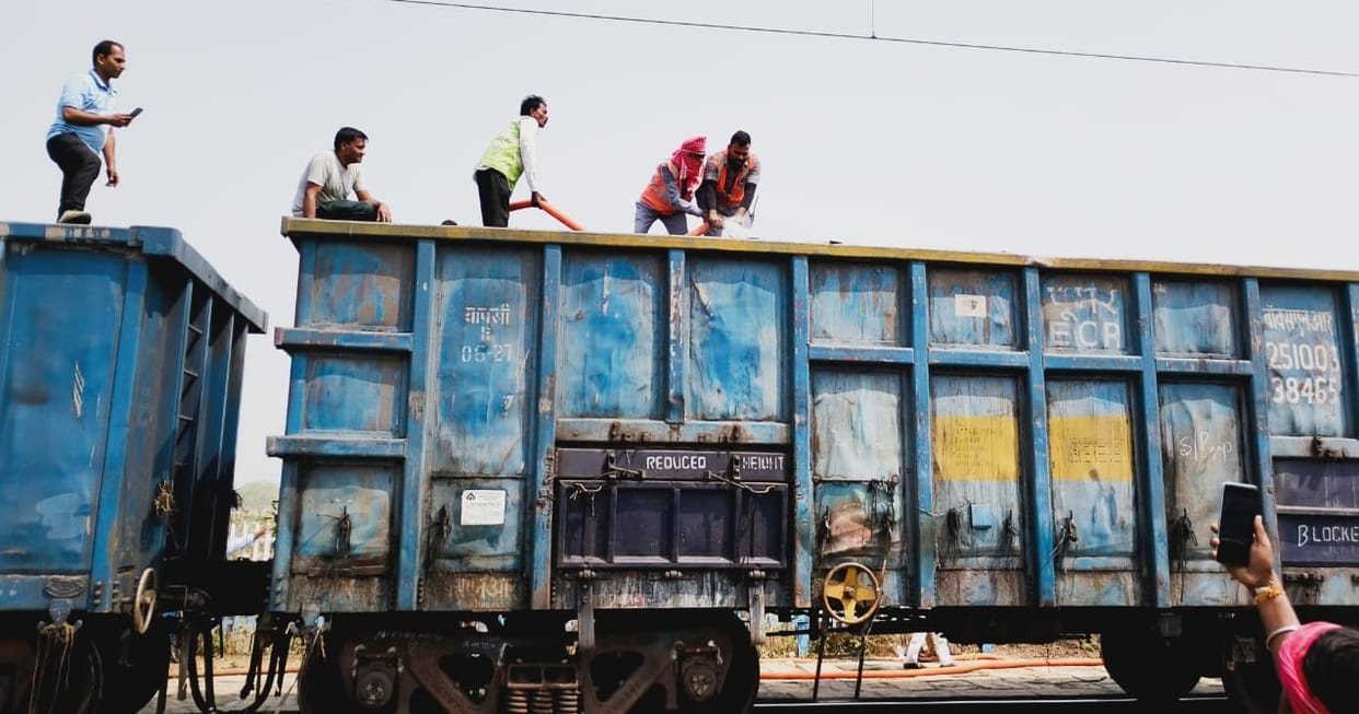 Fire broke out in a goods train loaded with coal fire brigade brought it under control reasons are not clear