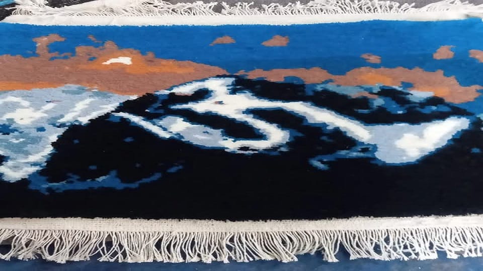 The design of Om mountain is tempting in traditional carpet in didihat