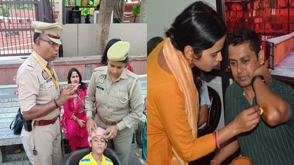 ताजमहल पर पर्यटकों को उपचार देते पुलिसकर्मी, और घायल पर्यटक