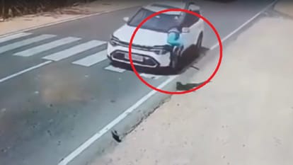 While crossing road in Lalitpur young man was hit by a car and fell twenty feet away