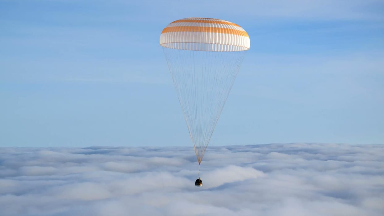 Soyuz capsule with 2 Russians and 1 American returns to Earth from International Space Station