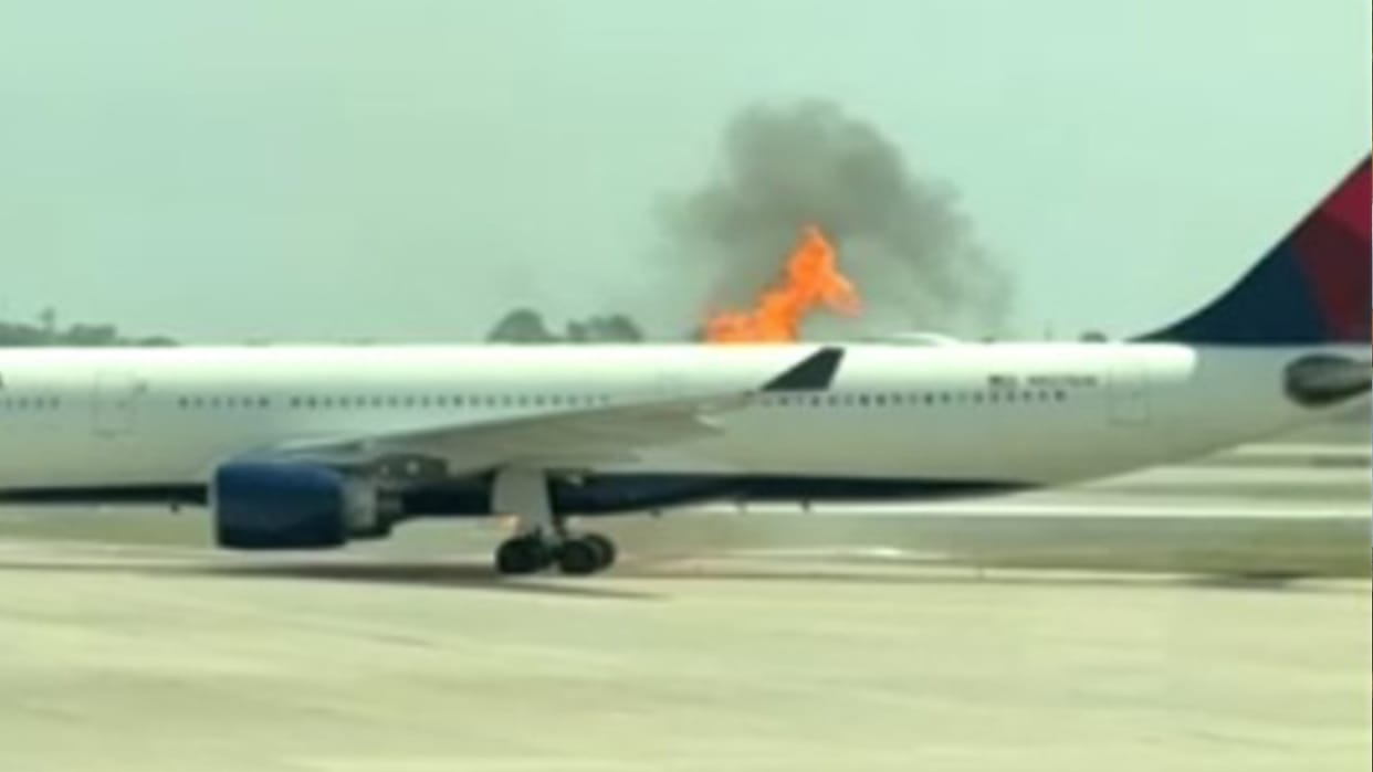 Delta plane catches fire at Orlando Airport in America passengers evacuated through emergency slides