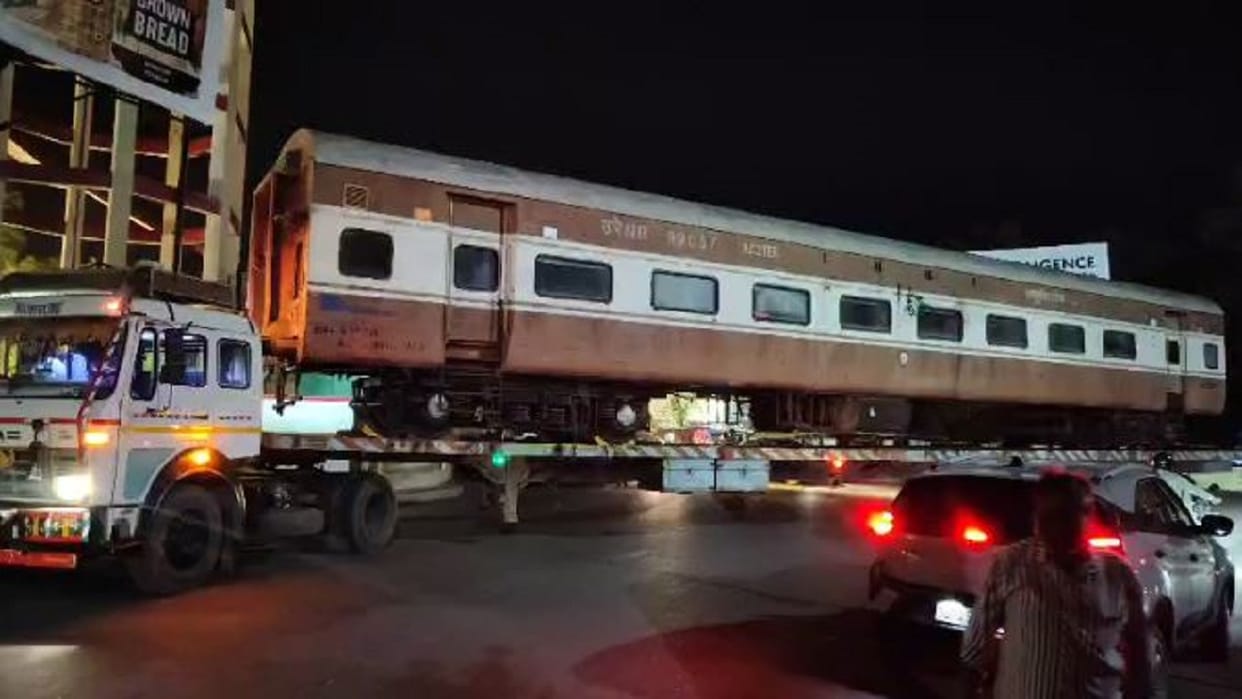 Railway coach brought by truck for restaurant at Bareilly Junction