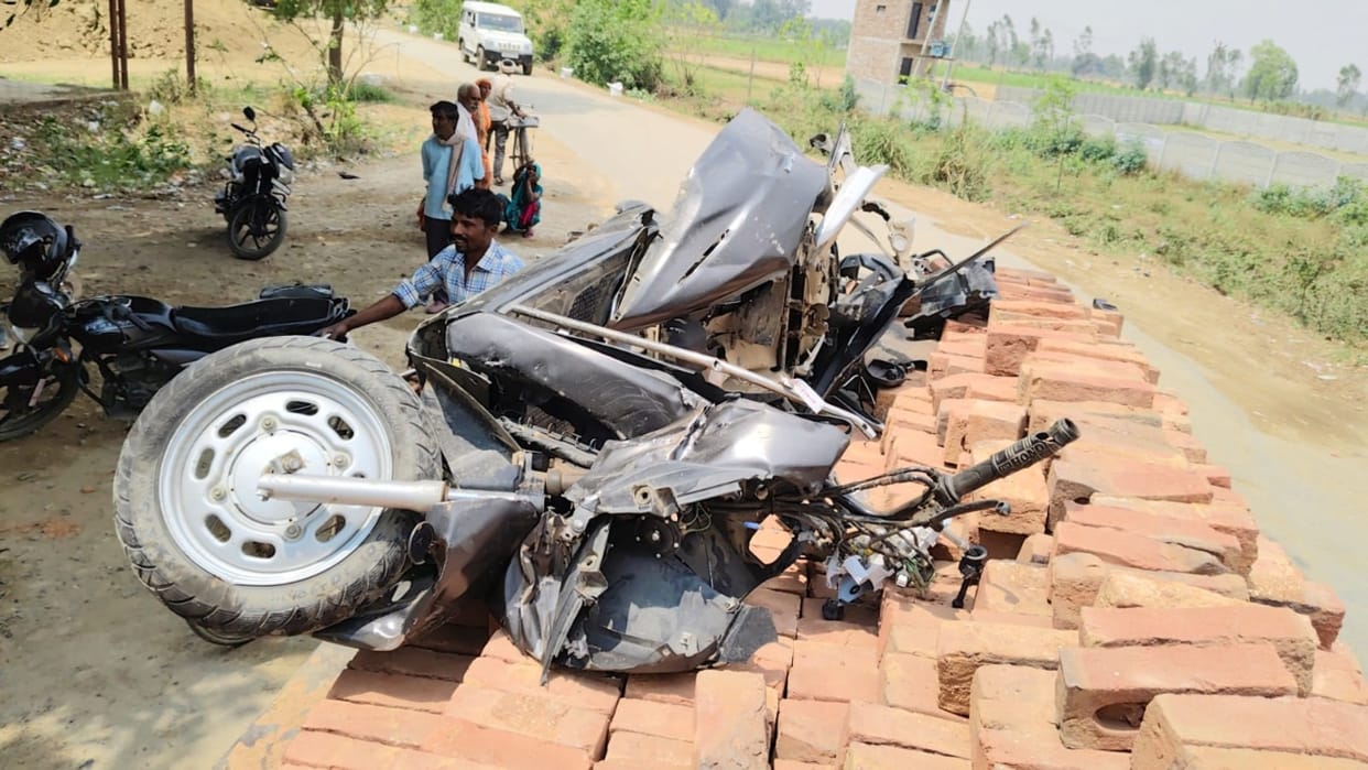 scooter smashed to pieces after hit by Rajya Rani Express on railway crossing