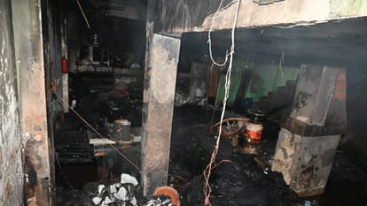 Kanpur Fire Incident fire on ground floor and lock on stairs to roof see photos