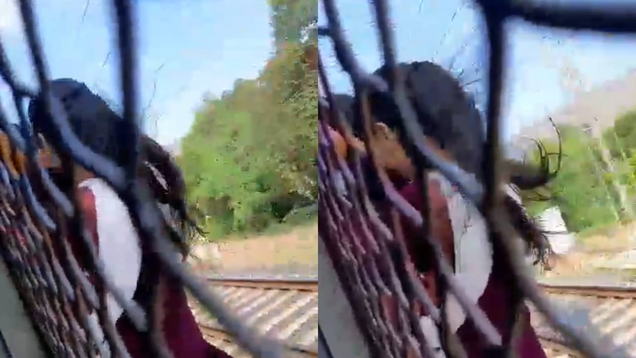 Crowd forced a woman to hang on a local train in Mumbai Video goes viral on Internet