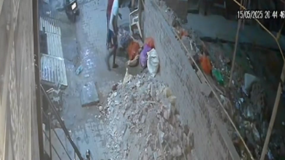 A woman died after falling from the roof of a four-storey house