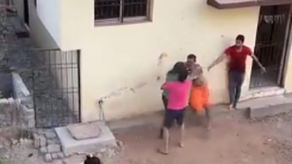 There was a dispute between two families over garbage disposal